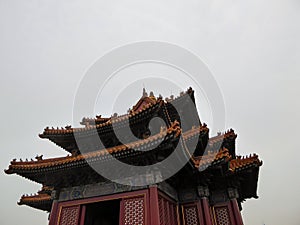 Beijing - A close up on the rooftop of a pavilion in Forbidden City in Beijing, China. The building is very colorful