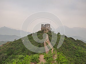 Beijing - A panoramic view on an unrenewed Gubeikou part of Great Wall of China. The wall is spreading on tops of mountains