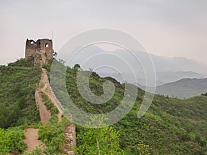 Beijing - A panoramic view on an unrenewed Gubeikou part of Great Wall of China. The wall is spreading on tops of mountains