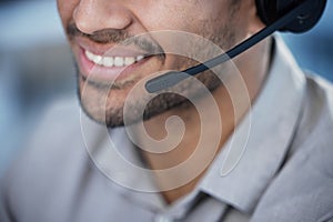 Being friendly is important. an unrecognisable customer service agent talking into his headset in the office.