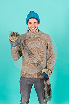 Being in playful mood. men knitted cloth and accessory. male blue background. poor homeless man. cheerful man feeling