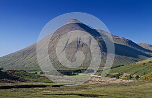 Beinn Dorain mountain under a blue sky