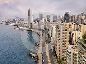 Beirut`s corniche sea front with high rise residential buildings and pedestrian walkway along the Mediterranean sea, Lebanon