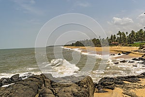 Rocky beach facing Waves - Bekal photo