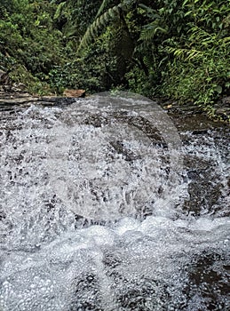 Bekasi, Indonesia, foam from the swift current of water in a river. photo