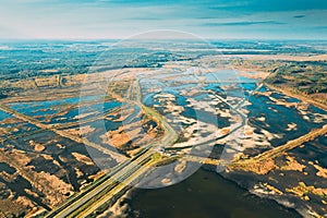 Belarus. Aerial View Of Road Through Ponds In Autumn Landscape. Ponds Of Fisheries In The South Of Belarus. Top View Of
