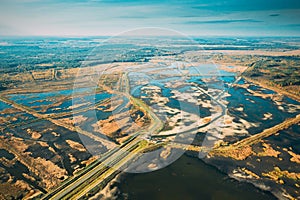 Belarus. Aerial View Of Road Through Ponds In Autumn Landscape. Ponds Of Fisheries In The South Of Belarus. Top View Of