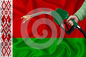 BELARUS flag Close-up shot on waving background texture with Fuel pump nozzle in hand. The concept of design solutions. 3d