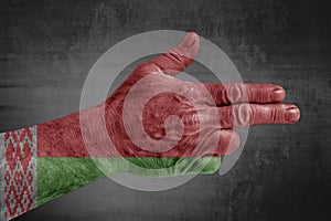 Belarus flag painted on male hand like a gun