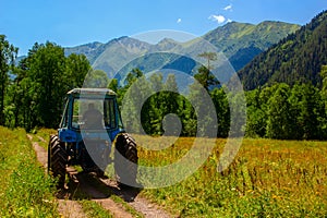 Belarus tractor in the mountains in the Caucasus, Arkhyz village.