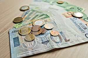 Belarusian rubles and coins on a colored background photo