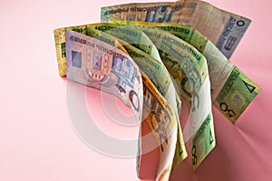 Belarusian rubles and coins on a colored background photo
