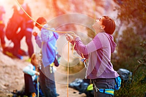 Belayer with the rope and carabines