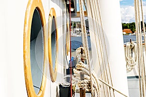 Belayingl pins and window or porthole on a tall ship