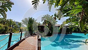 Belek, Turkey - May 2021: Hut on a tropical island. Cottage with pool in the jungle. Close-up. Tropical plants around the cottage