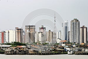 Belem: modern buildings and stilt houses on river Guama photo