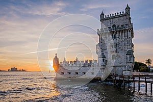 Belem Tower on the bank of the Tagus River on sunset. Lisbon, Portugal photo