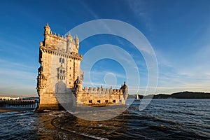 Belem Tower on the bank of the Tagus River on sunset. Lisbon, Portugal photo