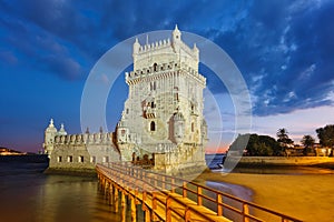 Belem Tower on the bank of the Tagus River in twilight. Lisbon, Portugal photo