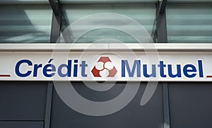 Credit mutuel logo on signboard on bank agency facade in the street