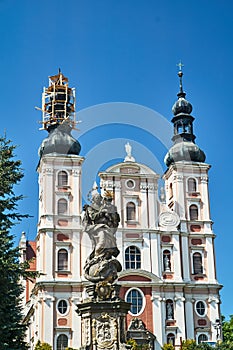 Belfries and facade of the Baroque Catholic church