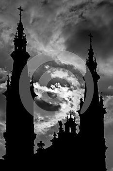 Belfries silhouettes of church against dramatic sky