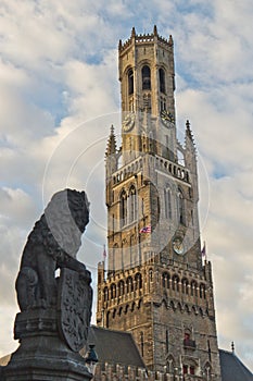 Belfry bell tower with lion statue in Bruges, Belgium