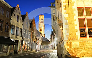 Belfry of Bruges and night street Bruges, Flemish Region, Belgium