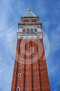 Belfry of St. Mark`s Basilica in Venice, Italy.Campanile di San Marco in Italian. Photographed from below along the wall