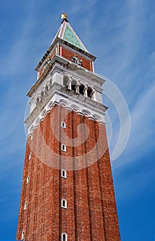 Belfry of St. Mark`s Basilica in Venice, Italy.Campanile di San Marco in Italian. Photographed from below along the wall