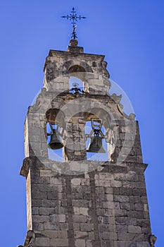 Belfry tops the bell tower of the Church of Santo Domingo photo