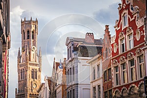 Belfry tower and flemish architecture in Bruges at sunny day, Belgium