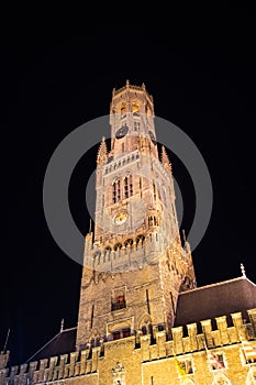 Belfry Tower in historical center of Bruges at night, Belgium