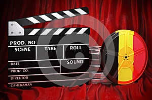 Belgian cinematography, film industry, cinema in Belgium. Clapperboard with and film reels on the red fabric, 3D rendering