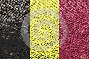 Belgian Flag on a Cobblestone Road Pattern