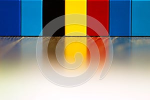 Belgian flag made of lego pieces with reflection