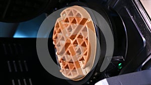 Belgian Viennese Wavy Waffles. The cooking process in an electric waffle iron. Cooking. vertical videos