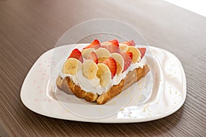 Belgian waffle with banana and strawberry