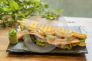 Belgian waffle with fish and avocado