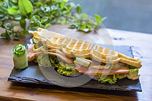 Belgian waffle with fish and avocado