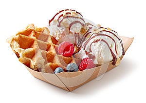 Belgian waffle with fresh berries and vanilla ice cream