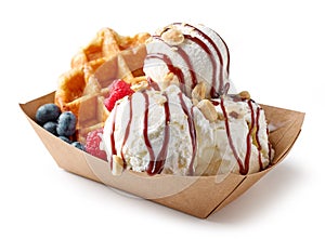 Belgian waffle with fresh berries and vanilla ice cream photo