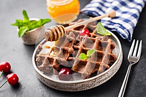 Belgian waffles with honey and berries