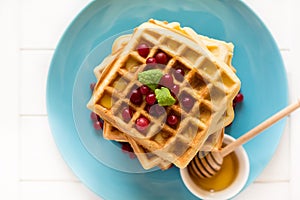 Belgian waffles with honey and cranberries