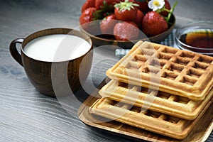 Belgian waffles with honey and fresh berries