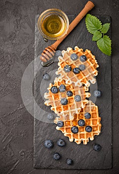 Belgian waffles with honey and fresh berries blueberry and mint