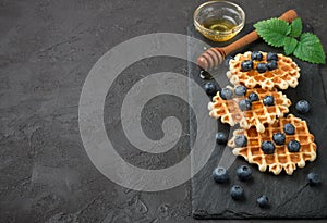 Belgian waffles with honey and fresh berries blueberry and mint