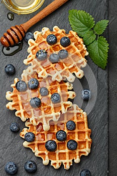 Belgian waffles with honey and fresh berries blueberry and mint