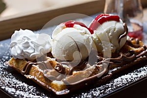 Belgian waffles with ice cream , chocolate,