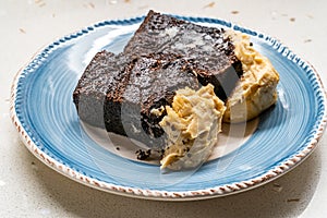 Belgium Chocolate Cake with Peanut Butter Cream served with Plate